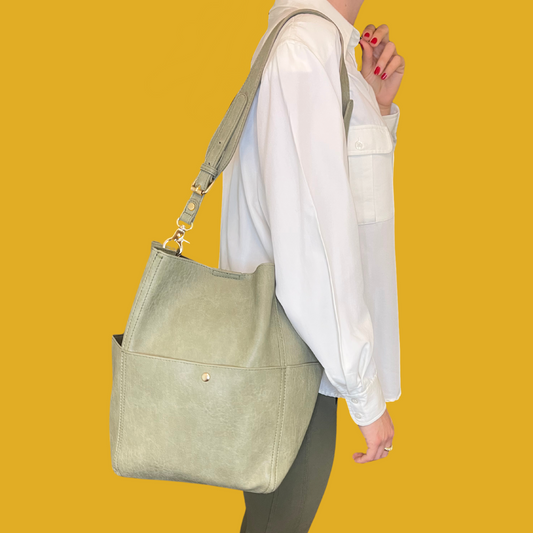 1. Handbag - Light olive green leather with golden accents