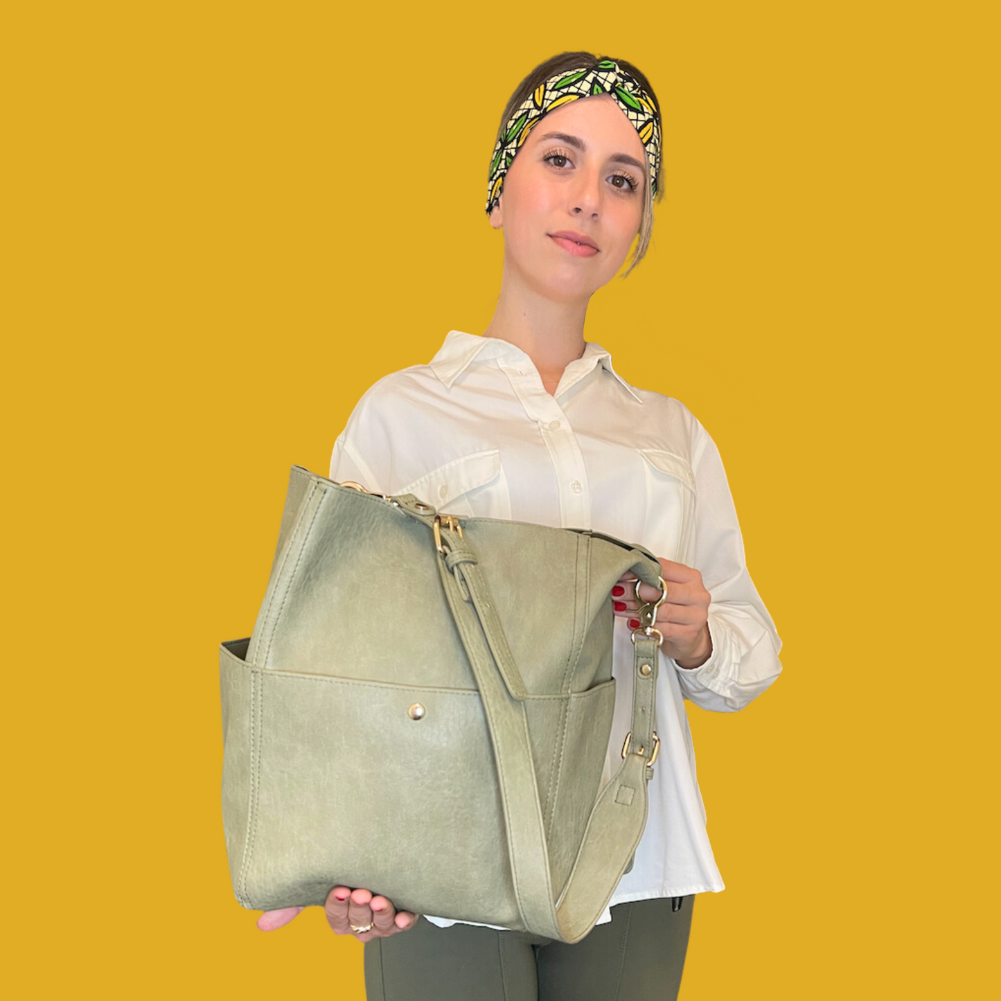 1. Handbag - Light olive green leather with golden accents